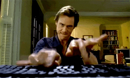 Jim Carrey tape frénétiquement un nom de domaine sur un clavier.