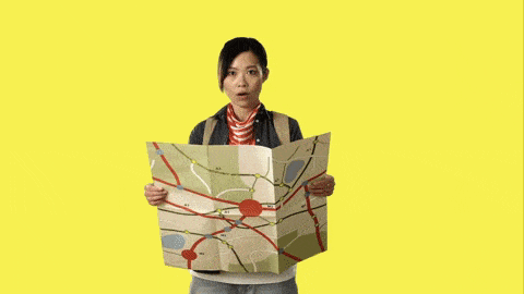 Woman hides behind a map