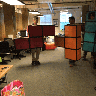 Teenagers dressed as tetrominoes (pieces of the game Tetris).