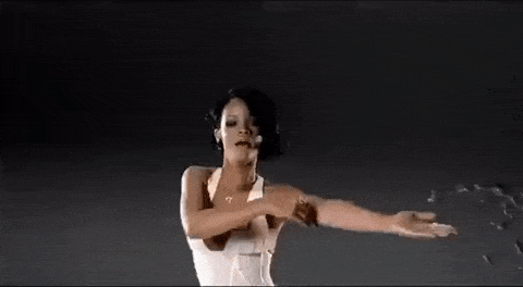 Rihanna dances in the rain.
