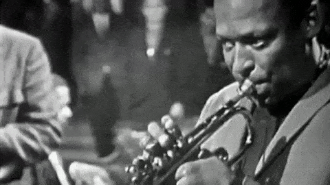 A man playing a trumpet.